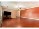 Spacious living room with hardwood floors and neutral color palette at 1239 Sharonton Dr, Stone Mountain, GA 30083