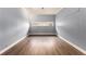 Room features wood paneling, a laminate floor, and a long window at 1239 Sharonton Dr, Stone Mountain, GA 30083