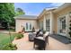 Inviting backyard patio with outdoor seating area, manicured lawn, and lush landscaping perfect for entertaining at 3151 Amesbury Way, Duluth, GA 30096