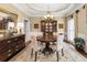 Formal dining room with a round wooden table, elegant chandelier, and classic decor for sophisticated gatherings at 3151 Amesbury Way, Duluth, GA 30096