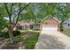 Charming brick home with a well-manicured front yard and attached two car garage at 3151 Amesbury Way, Duluth, GA 30096