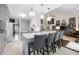 Bright, modern kitchen with white cabinets, marble countertops, and an open layout into the living area at 3151 Amesbury Way, Duluth, GA 30096