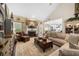 Comfortable living area with a fireplace, hardwood floors, and open layout leading to the kitchen at 3151 Amesbury Way, Duluth, GA 30096