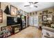 Inviting living room featuring a ceiling fan, quirky decor, and comfortable seating at 3151 Amesbury Way, Duluth, GA 30096