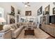 Spacious living room with vaulted ceilings, plush sectional sofa, and stylish decor, perfect for relaxation at 3151 Amesbury Way, Duluth, GA 30096