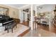 Open-concept living area with hardwood floors, neutral decor, and seamless transition to other rooms at 3151 Amesbury Way, Duluth, GA 30096