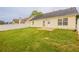 Backyard with lawn, patio, and white fence offers a great outdoor space at 4045 Meadow Glen Way, Fairburn, GA 30213