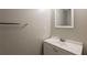 Powder room featuring a toilet, sink with a vanity, and a mirror at 4045 Meadow Glen Way, Fairburn, GA 30213