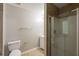 Full bathroom featuring a glass enclosed shower, toilet, and sink at 4045 Meadow Glen Way, Fairburn, GA 30213