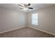 Neutral bedroom with carpet, ceiling fan and a bright window at 4045 Meadow Glen Way, Fairburn, GA 30213