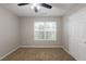 Neutral bedroom with carpet, ceiling fan and a bright window and door at 4045 Meadow Glen Way, Fairburn, GA 30213