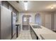 Modern kitchen with stainless steel appliances, dark wood cabinets, and an eat-in bar at 4045 Meadow Glen Way, Fairburn, GA 30213