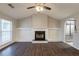 Bright living room with fireplace, built-ins, and hardwood floors at 4045 Meadow Glen Way, Fairburn, GA 30213