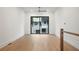 Upstairs bedroom boasting hardwood floors and a large slider to private balcony at 651 Soul Aly # 135, Alpharetta, GA 30009