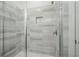 Modern shower with sleek tile and glass enclosure, offering a spa-like experience at 651 Soul Aly # 135, Alpharetta, GA 30009