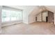 Spacious carpeted attic space with dormer windows and natural light at 1142 Wiley Bridge Rd, Woodstock, GA 30188