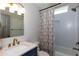 Bathroom featuring white hexagon tiles in shower and vanity with gold fixtures at 1142 Wiley Bridge Rd, Woodstock, GA 30188