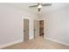 Neutral bedroom featuring a ceiling fan and an open doorway at 1142 Wiley Bridge Rd, Woodstock, GA 30188