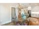 Bright dining area featuring a glass table and kitchen island with bar seating at 1142 Wiley Bridge Rd, Woodstock, GA 30188