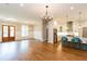 Expansive living space with hardwood floors, connecting the entry, kitchen, and dining areas at 1142 Wiley Bridge Rd, Woodstock, GA 30188