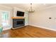 Bright living room featuring a sleek fireplace and hardwood floors at 1142 Wiley Bridge Rd, Woodstock, GA 30188