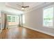 Spacious main bedroom with tray ceilings, recessed lighting, and large windows at 1142 Wiley Bridge Rd, Woodstock, GA 30188