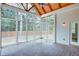 Screened porch with brick floor and natural wood vaulted ceiling at 1142 Wiley Bridge Rd, Woodstock, GA 30188