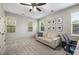 Neutral bedroom with a comfortable seating area and natural light at 3087 Dunton Se St, Smyrna, GA 30080