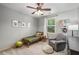 Comfortable bedroom with a twin bed, ceiling fan, and chair with footstool at 3087 Dunton Se St, Smyrna, GA 30080