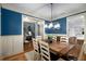 Open-concept dining room with hardwood floors, modern lighting, and seamless flow to other rooms at 3087 Dunton Se St, Smyrna, GA 30080