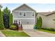 Charming two-story home with a well-manicured lawn, attached garage, and inviting curb appeal at 3087 Dunton Se St, Smyrna, GA 30080