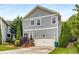 Beautiful two-story home with a well-maintained lawn, attached garage, and lovely landscaping at 3087 Dunton Se St, Smyrna, GA 30080