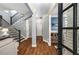 Inviting foyer featuring hardwood floors and staircase to upper level at 3087 Dunton Se St, Smyrna, GA 30080