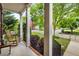 Inviting front porch with rocking chair and manicured landscaping at 3087 Dunton Se St, Smyrna, GA 30080
