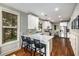 Stylish kitchen with counter seating, stainless steel appliances, and ample cabinet space at 3087 Dunton Se St, Smyrna, GA 30080