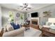 Comfortable living room with a fireplace, plenty of natural light, and stylish decor at 3087 Dunton Se St, Smyrna, GA 30080