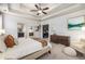 Inviting primary bedroom showcasing a tray ceiling, dresser, and adjoining ensuite bathroom at 3087 Dunton Se St, Smyrna, GA 30080
