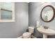 Stylish powder room with modern fixtures and a decorative mirror at 3087 Dunton Se St, Smyrna, GA 30080