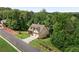 Scenic aerial shot of the property showcasing its lush, wooded surroundings, well-kept lawn, and proximity to nature at 42 Treemont Se Dr, Cartersville, GA 30121
