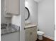 Powder room featuring a granite counter and decorative mirror at 42 Treemont Se Dr, Cartersville, GA 30121