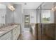Primary bath features a glass-enclosed shower, soaking tub and granite countertops at 42 Treemont Se Dr, Cartersville, GA 30121