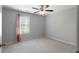 Clean and bright bedroom with a large window and minimalist decor at 42 Treemont Se Dr, Cartersville, GA 30121