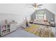 Bright bedroom with a fun tent, decorative pillows, and a playful yellow rug at 42 Treemont Se Dr, Cartersville, GA 30121