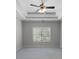 Spacious bedroom featuring a ceiling fan and a large window for natural light at 42 Treemont Se Dr, Cartersville, GA 30121