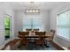 Charming dining room features a modern chandelier and a door to the deck at 42 Treemont Se Dr, Cartersville, GA 30121