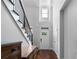 Bright foyer featuring hardwood floors, staircase, and access to various rooms in the house at 42 Treemont Se Dr, Cartersville, GA 30121