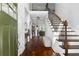 Grand foyer boasts hardwood floors, staircase, and a view into the bright, open-concept living spaces at 42 Treemont Se Dr, Cartersville, GA 30121