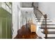 Welcoming foyer featuring hardwood floors, staircase, and a view into the bright, open living spaces at 42 Treemont Se Dr, Cartersville, GA 30121