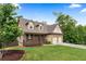 Inviting two-story home with a charming front porch, a well-maintained lawn, and an attached two-car garage at 42 Treemont Se Dr, Cartersville, GA 30121