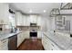 Stylish kitchen featuring granite countertops, stainless steel appliances, modern lighting, and custom cabinets at 42 Treemont Se Dr, Cartersville, GA 30121